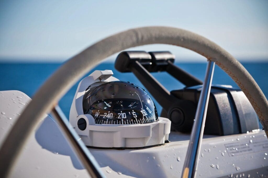 A closeup look of a speedometer of a boat