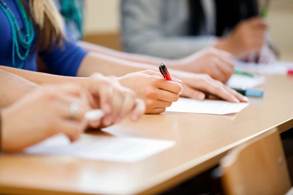 A closeup look of a hand holding a pen